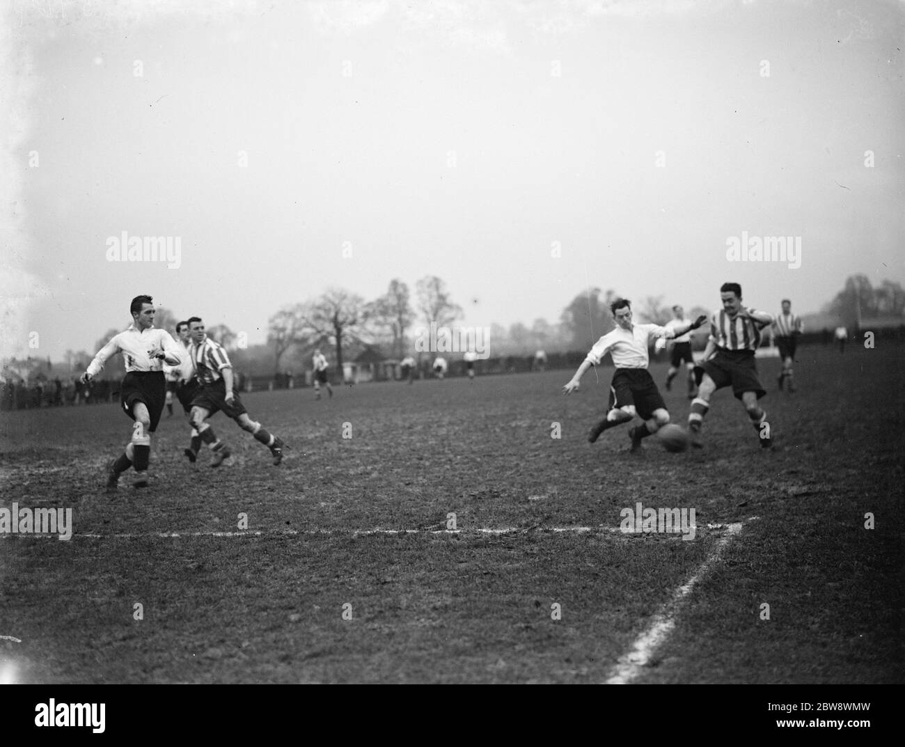 Dartford versus Bromley football match . Two players compete for the ball . 1937 Stock Photo