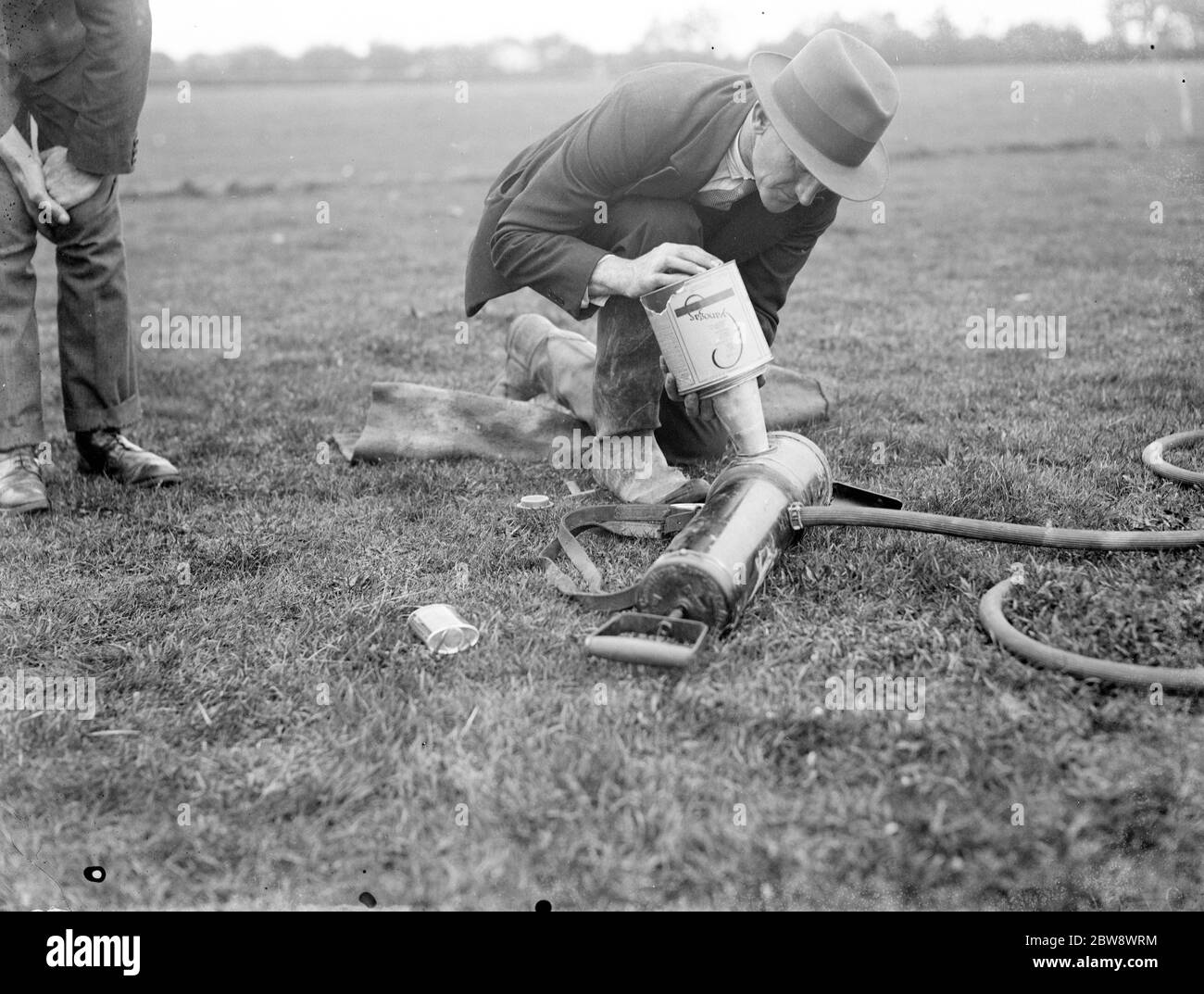 A pest controller prepares a demonstration of cyanogas . 1936 Stock Photo