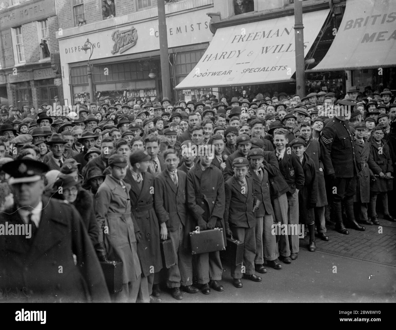 Announcing the new King in Dartford . A crowd of people including many schoolboys listen while the Royal Proclamation of the accession of Edward VIII is read out in Dartford , Kent . 1936 Stock Photo