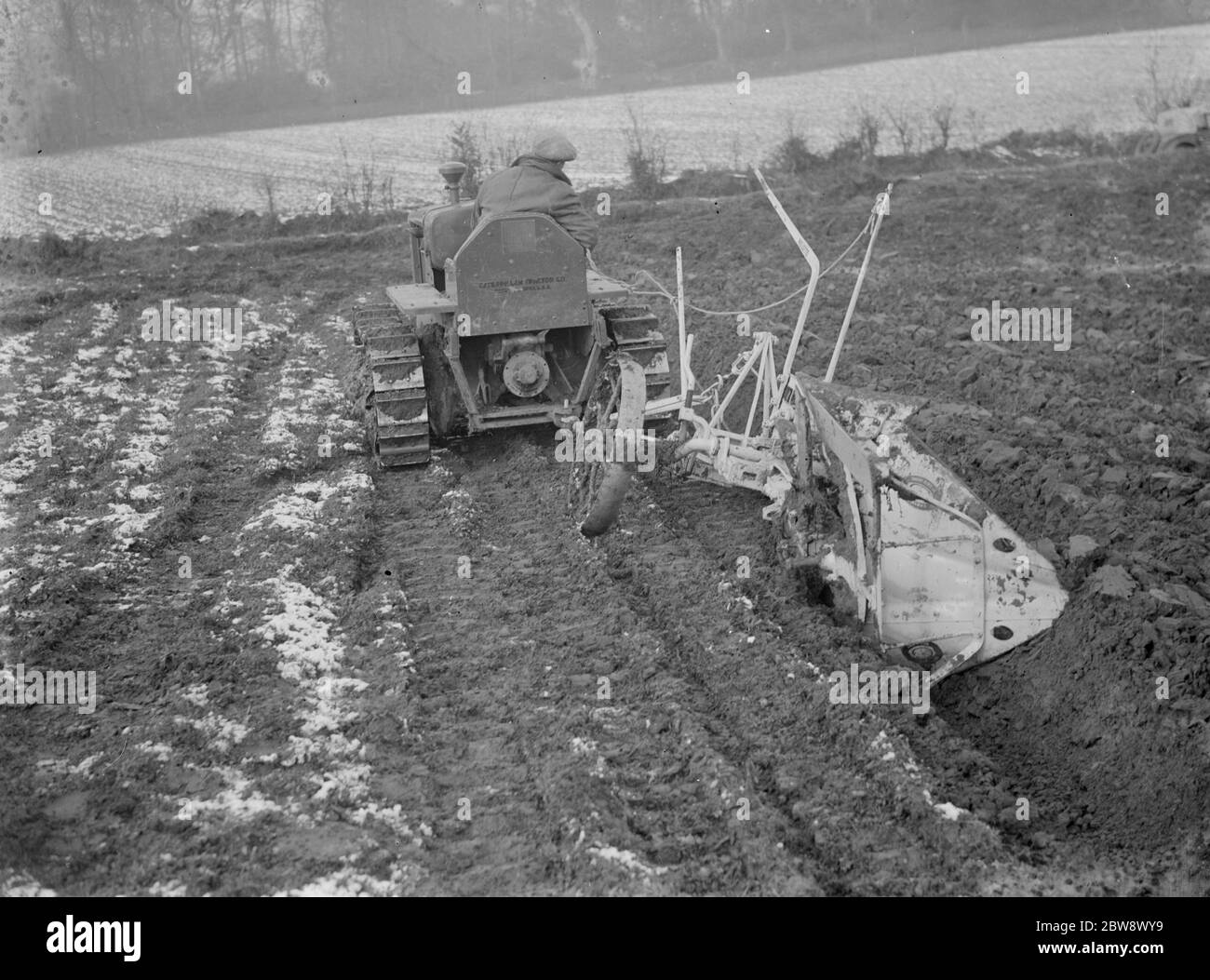 A ploughing demonstration with the new Melotte tractor fitted with continuous tracks . 1936 Stock Photo
