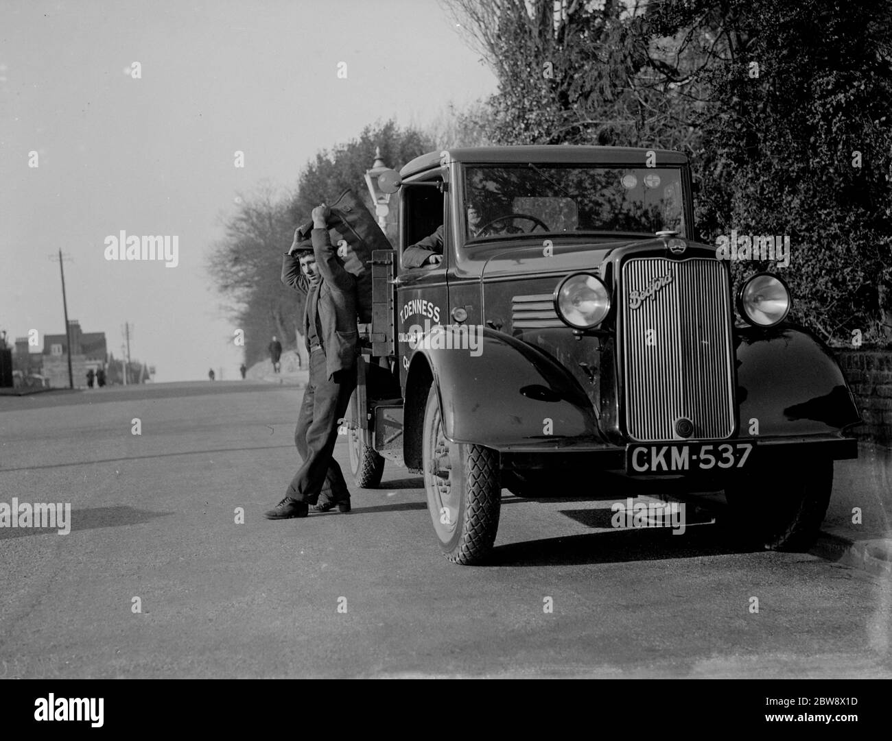 Coal delivery by one of the coal vans from T Denness , Coal and Coke Merchants in Chislehurst , Kent . 1936 . Stock Photo