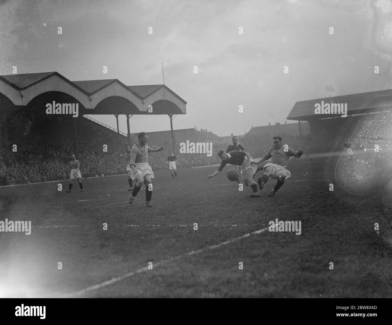 Nottingham Forest Football Club versus Charlton Athletic football club . two players compete for the ball . 10 April 1936 Stock Photo