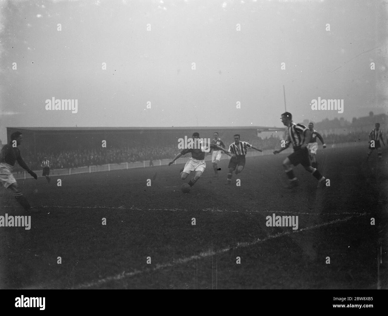 Dartford football club versus Peterborough United Football Club . Two players compete for the ball . 1936 Stock Photo