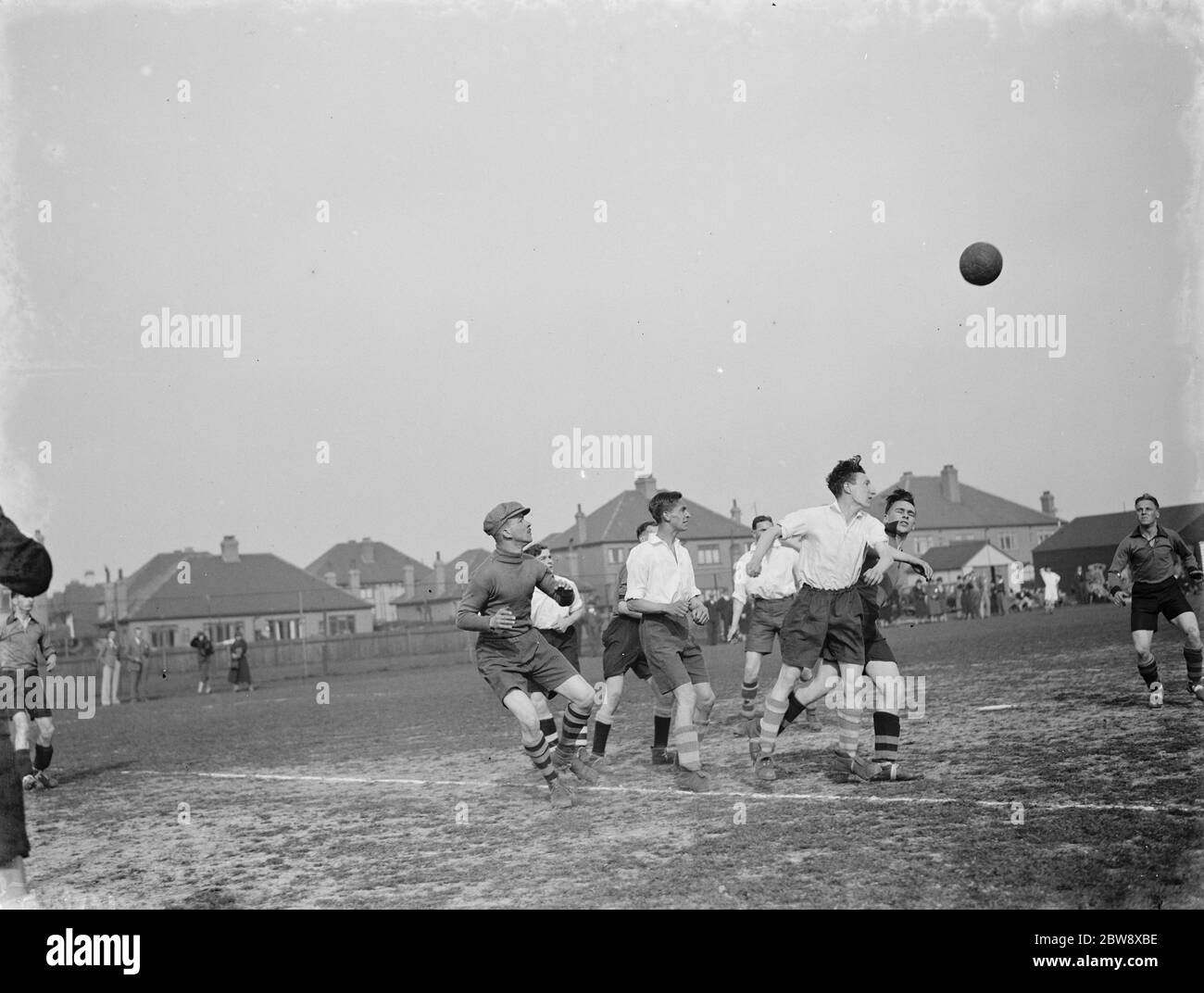 London football club versus Birmingham , methodist football . Attackers and defenders fight as the ball as it comes through the air while R O Ayres , the London keeper has eyes only for the ball . 1939 Stock Photo