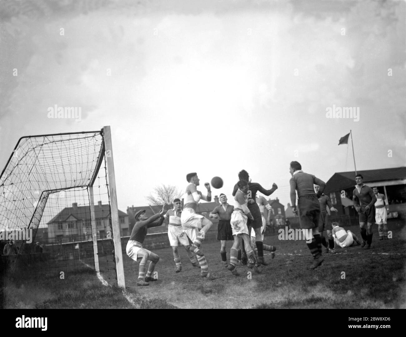 Erith and Belvedere vs. Cray Wanderers - Kent League - 10/04/36 The ball bounces round a crowded box . 1936 Stock Photo