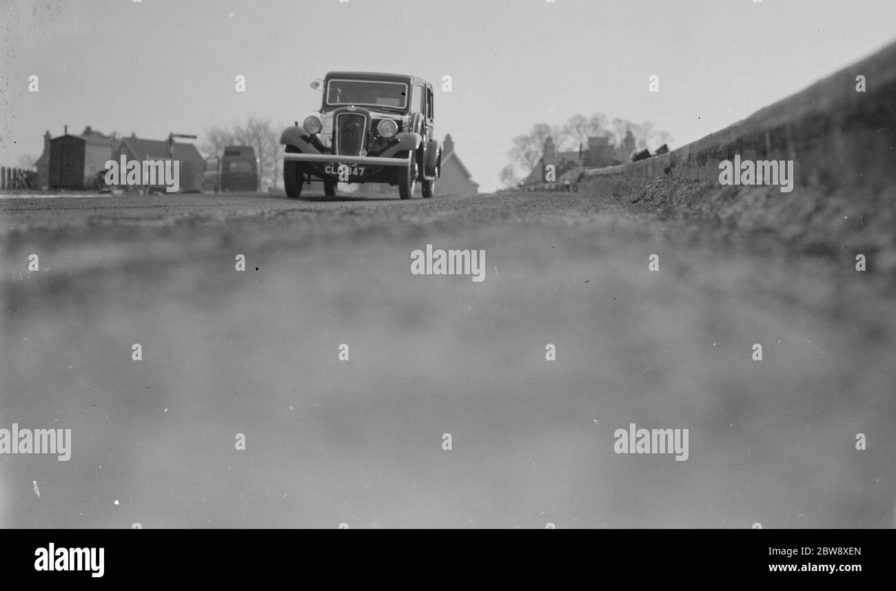 Workmen lay the foundations for road banking along the edges of the road in Farningham , Kent . 1936 Stock Photo