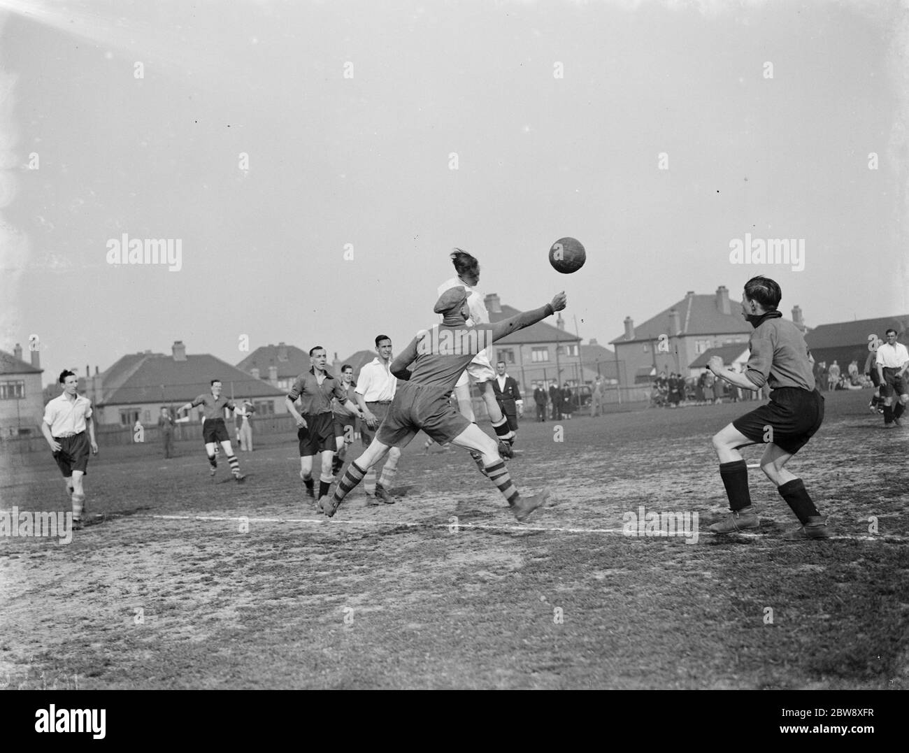 London football club versus Birmingham , methodist football . R O Ayres , the London keeper punches the ball from the head of an attacker . 1939 Stock Photo