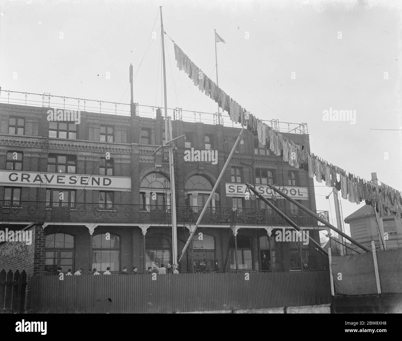 Washing is hanging from the mast at Gravesend Sea School in Kent . 1939 . Stock Photo