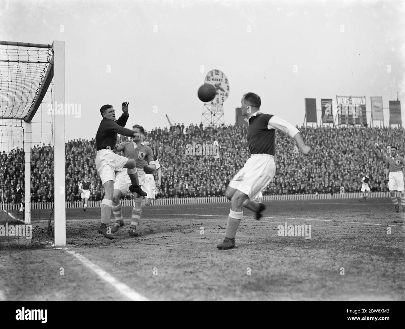 Football match between Millwall and Wolverhampton . Goal mouth action . 1937 Stock Photo