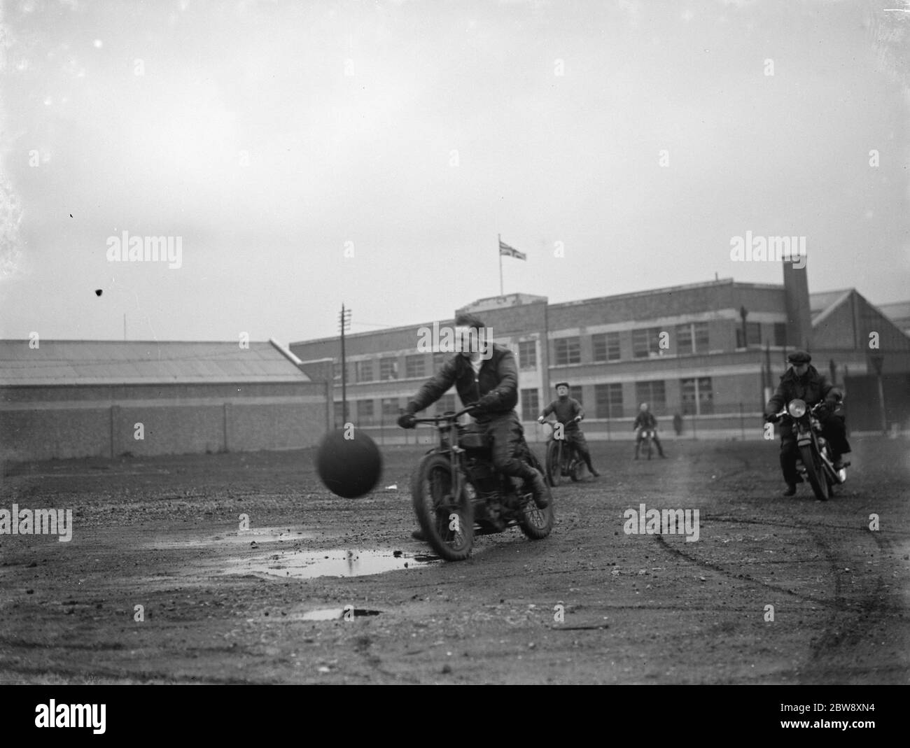Football on motorcycles at Hackney Wick Stadium in London . Here are the rider during practice . 1937 Stock Photo
