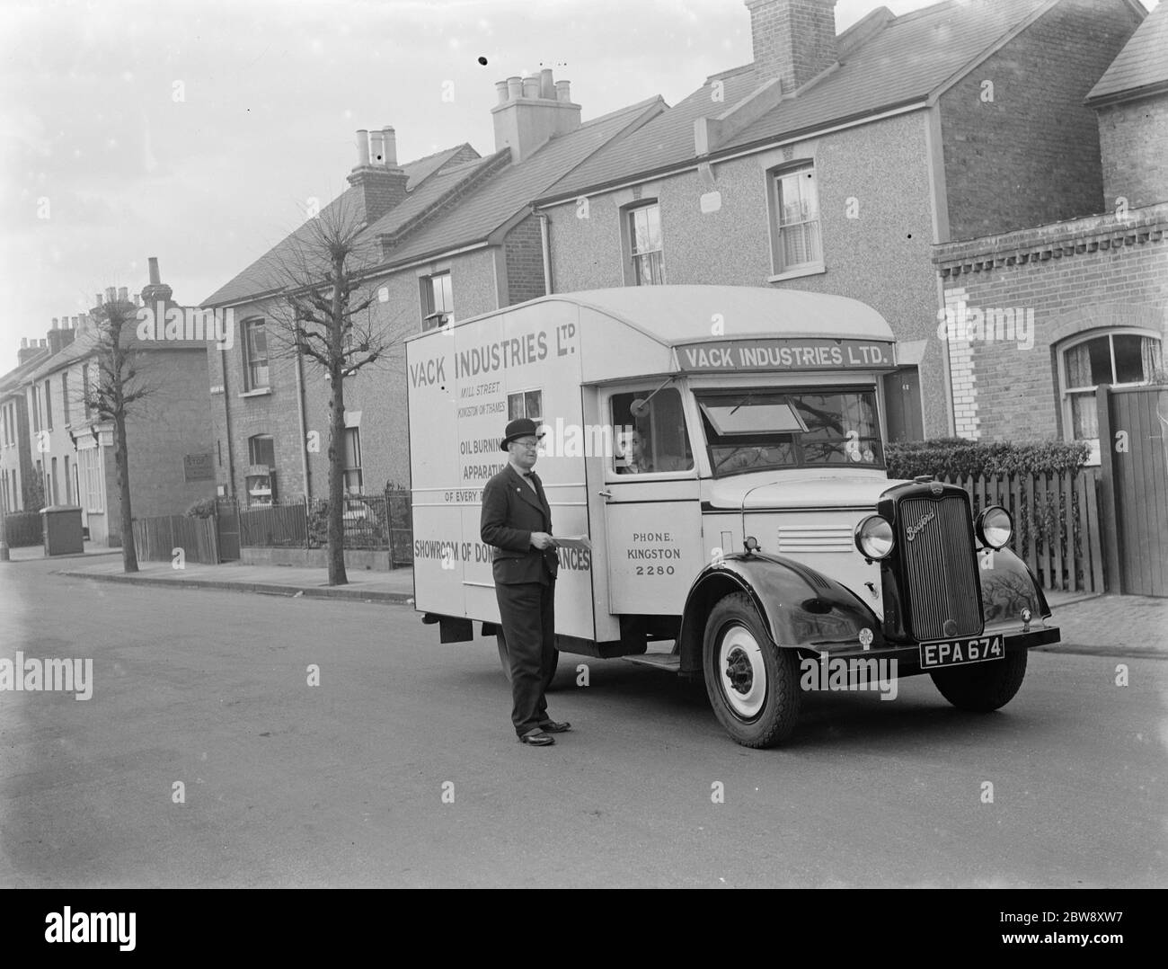 A Bedford truck belonging to Vack Industries Ltd from Kingston upon Thames , London , which has been converted into a mobile showroom for their oil burning apparatus and other domestic appliances . 1937 . Stock Photo