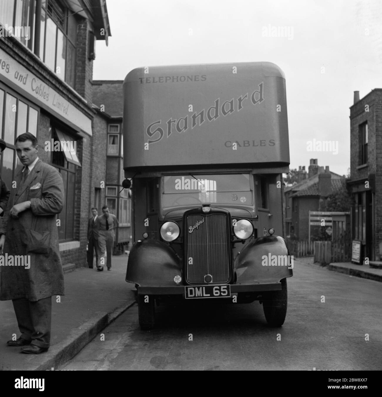 A Bedford truck belonging to the Standard Telephone and Cables Company Ltd , parked outside their store . 1936 . Stock Photo