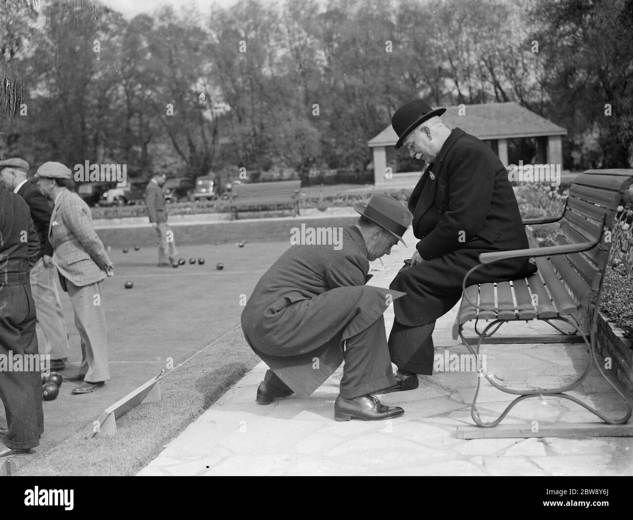 The Mayor of Dartford has rubber shoes put on his feet for bowling at Dartford bowls club . 1938 Stock Photo