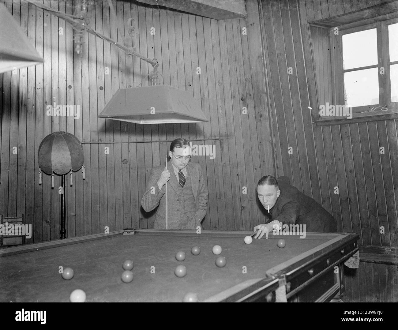 An old mill in Plumstead Common has gained a second lease of life as an Inn . Mr T Fossam and Mr Copelin playing billiards . 29 March 1939 Stock Photo