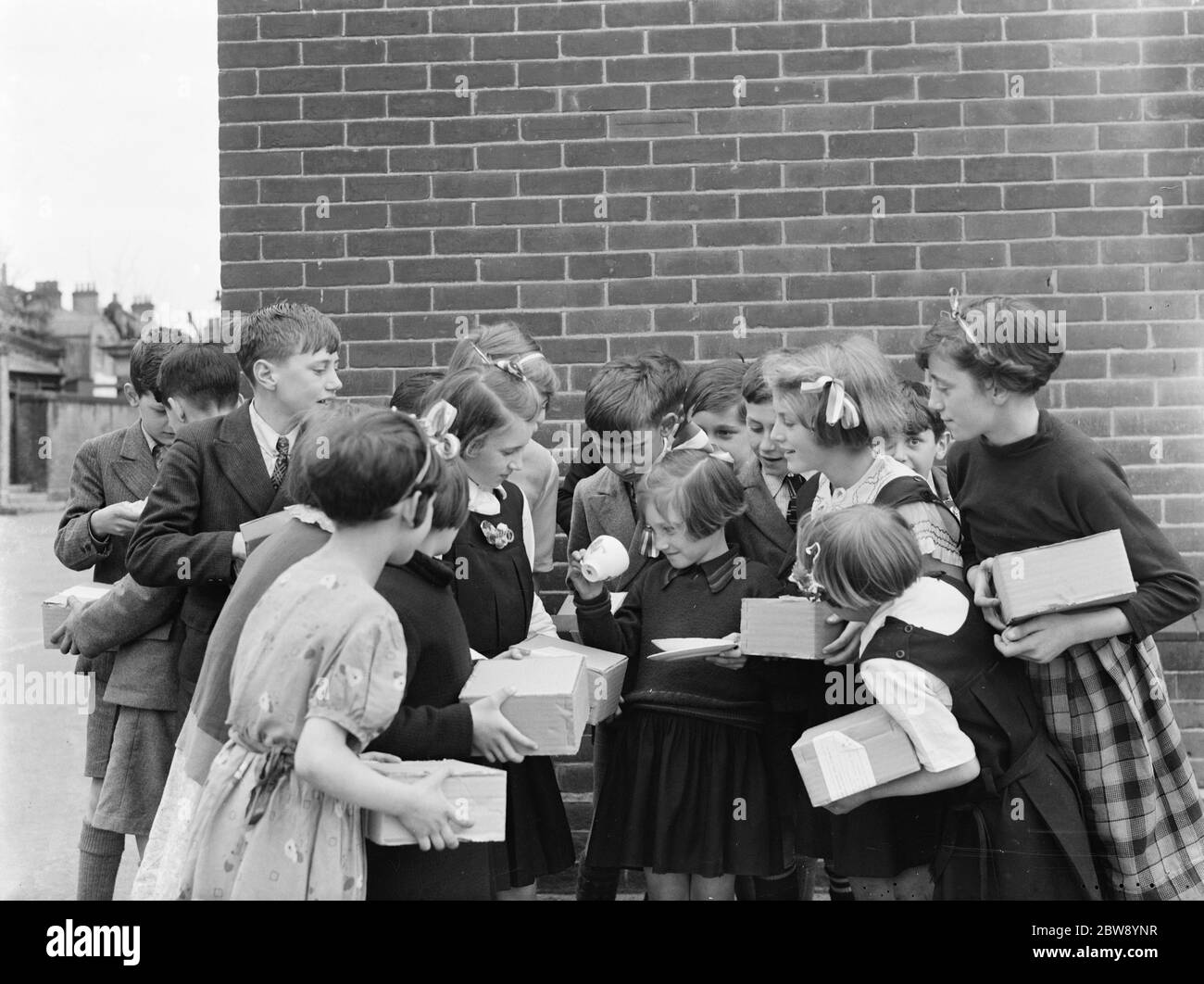 School children at Sidcup Hill School , Kent , with their coronation ...