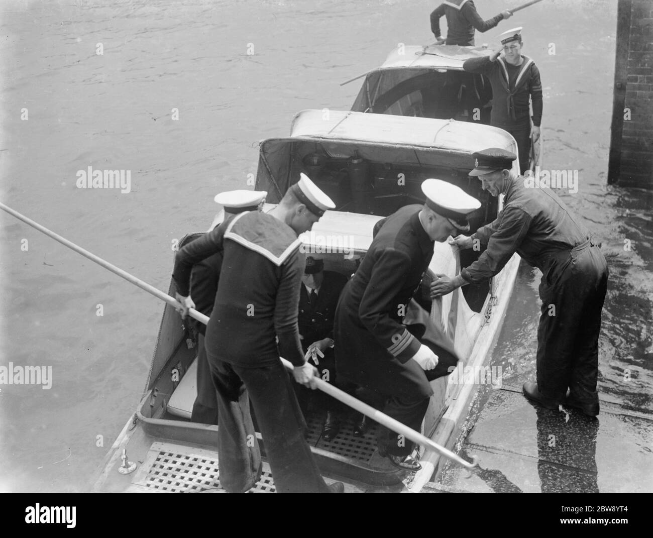 The Home Fleet on the river Thames at Erith , London . Sailors debark from a boat . 1937 Stock Photo