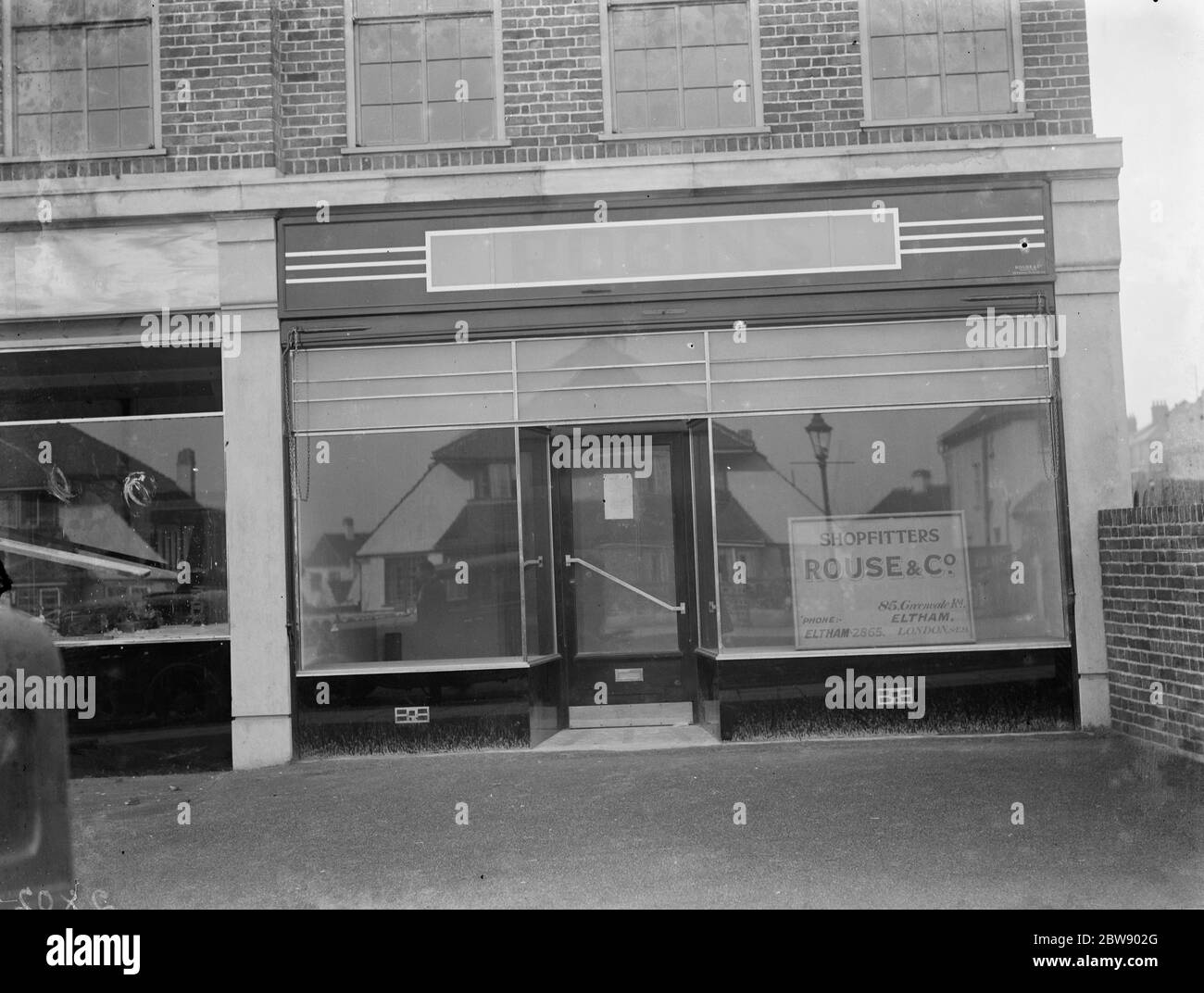 The empty shop window of Robin ' s Stores at Grove Park . 1936 Stock Photo