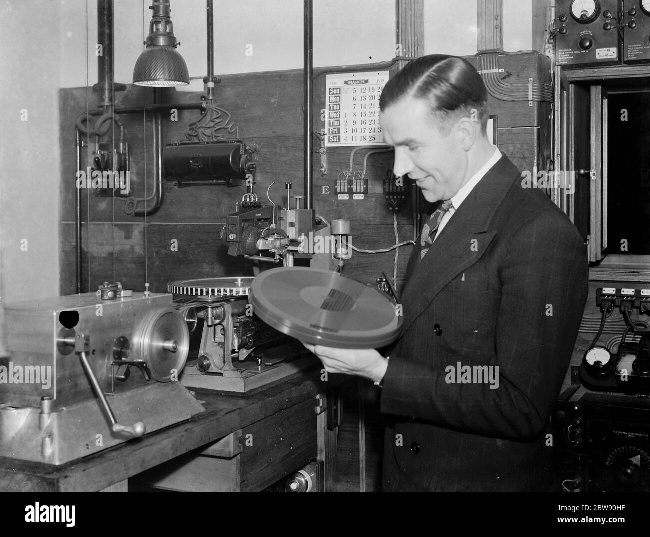 Mr Albert Deering with some wax recording equipment . 1939 Stock Photo