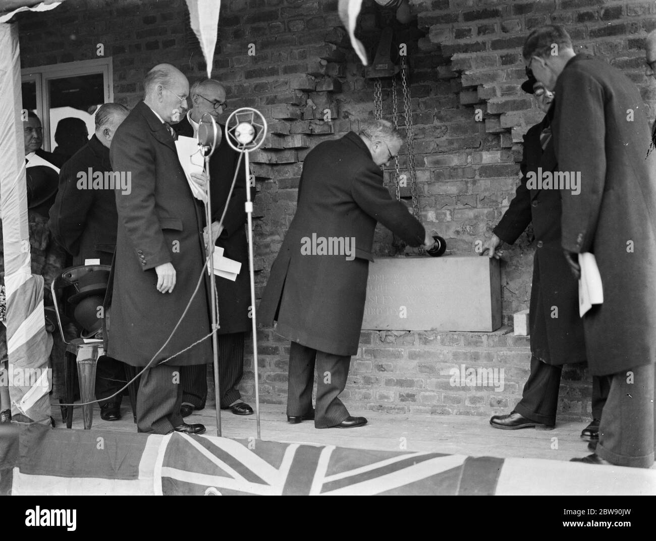 Sir Kingsley Wood laying the foundation stone at the new nurses home , at the Memorial Hospital in Shooters Hill . 1939 Stock Photo
