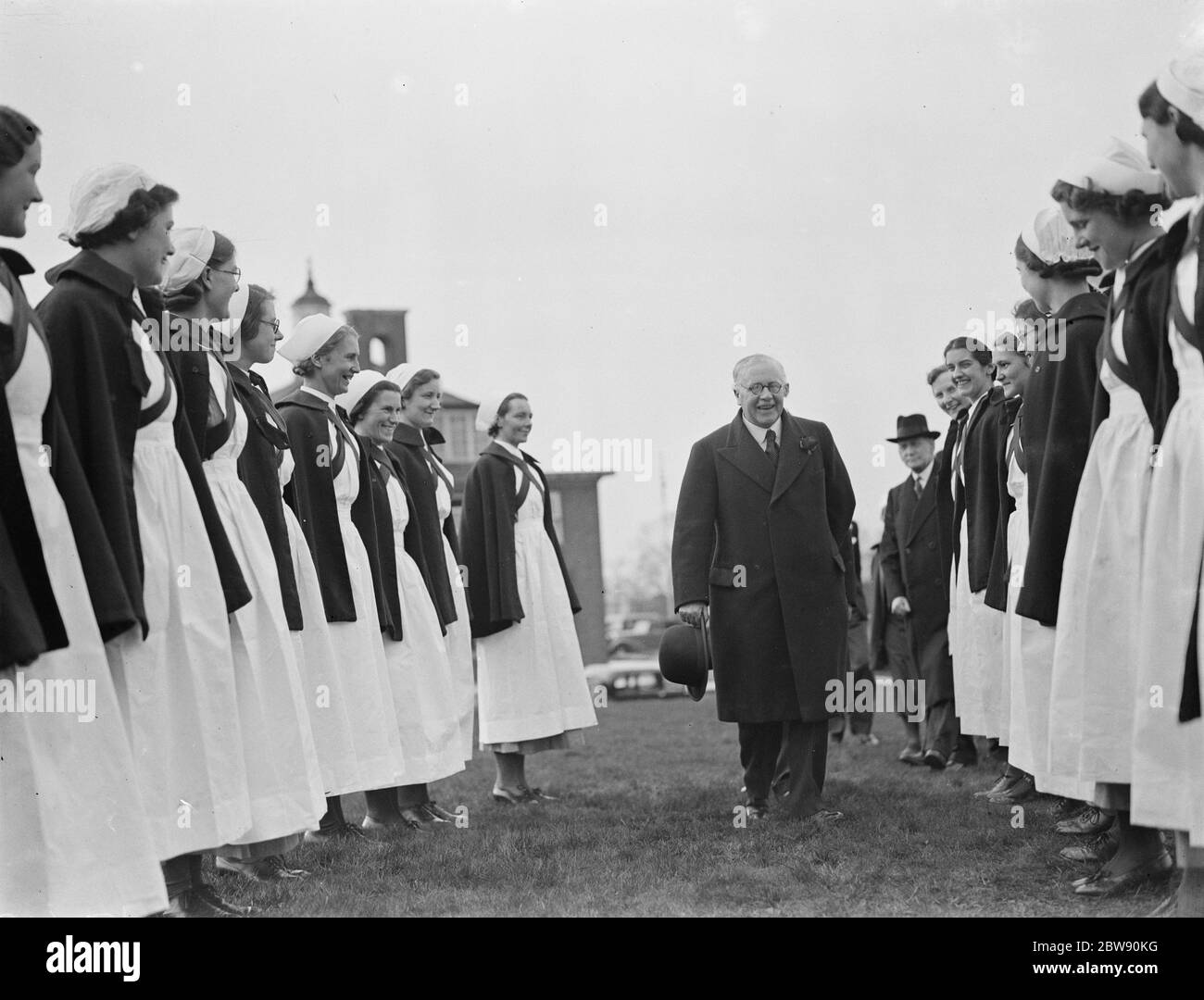 Nurses form a guard of honour for Sir Kingsley Wood . 1939 Stock Photo