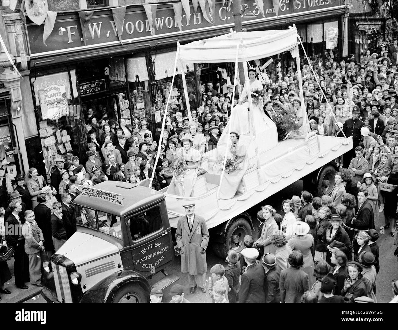 Erith carnival queen sitting on her throne on the back of a lorry at the procession . 1939 Stock