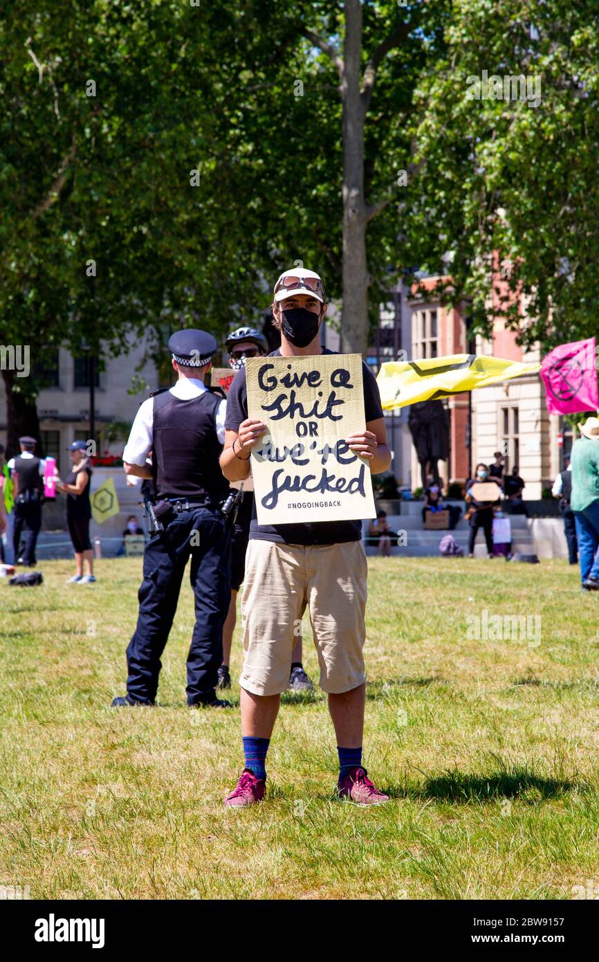 30 May 2020 London, UK - Extinction Rebellion stage silent socially-distanced climate change protest in Westminster, protesters being fined and taken away by police for breaching coronavirus regulations Stock Photo