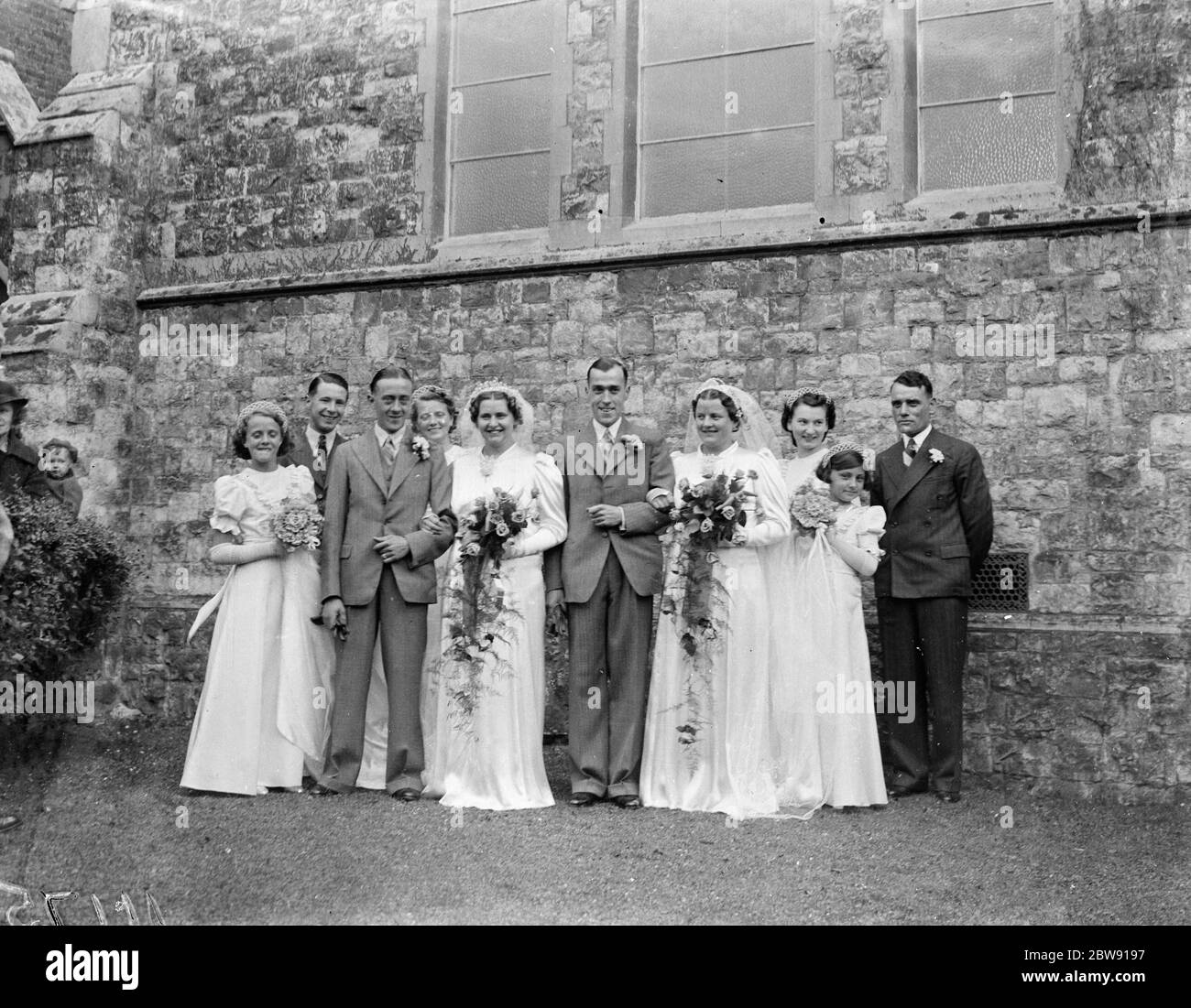 The double wedding of the Wood sisters in Mottingham , Kent . Miss Molly Kathleen Wood with Mr Cyril Leonard Andrew and Mrs Joyce Margaret Wood with Mr John Oliver Staples . 1939 Stock Photo