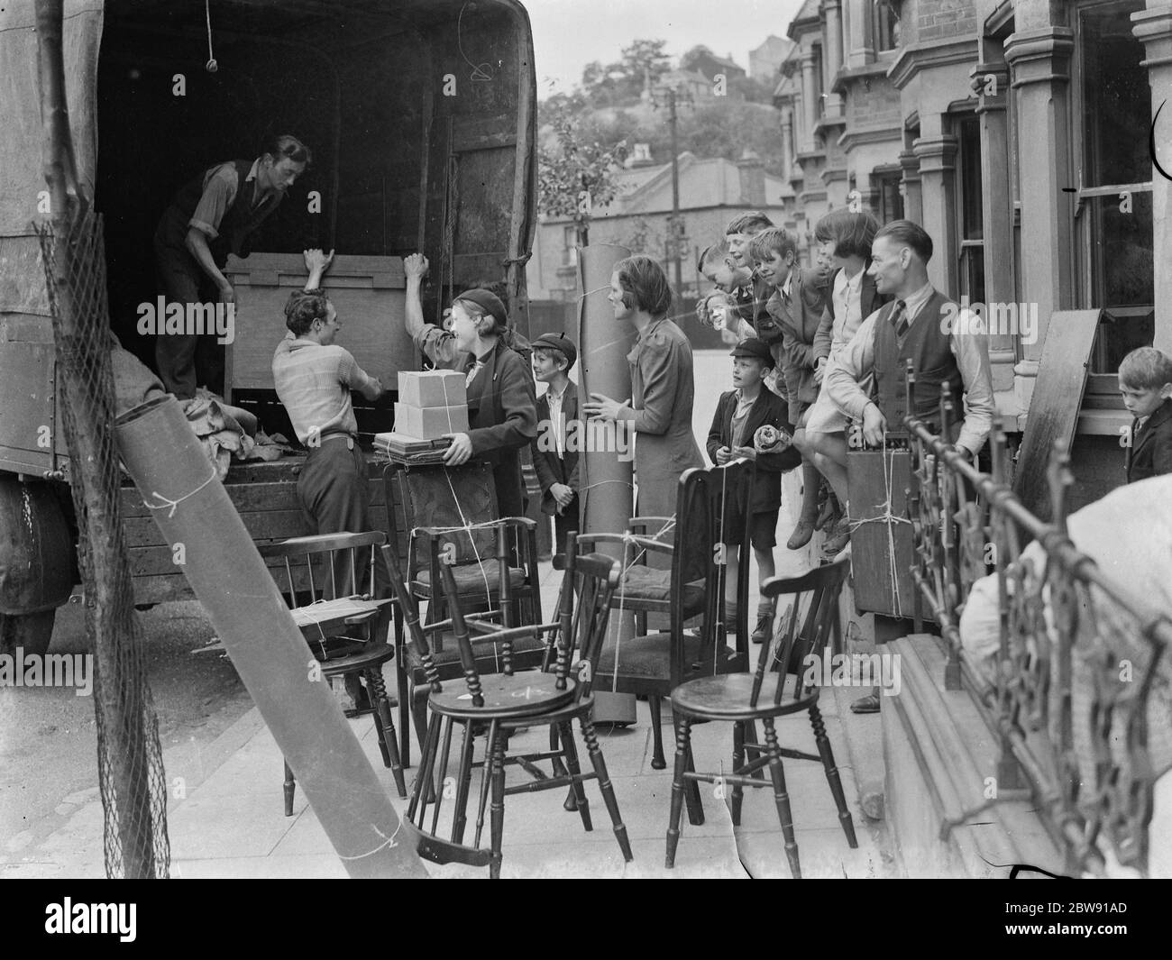 A residence in Plumstead , London , moves from Relliance Road . Here they are loading their belongings onto a removal lorry . 1939 Stock Photo