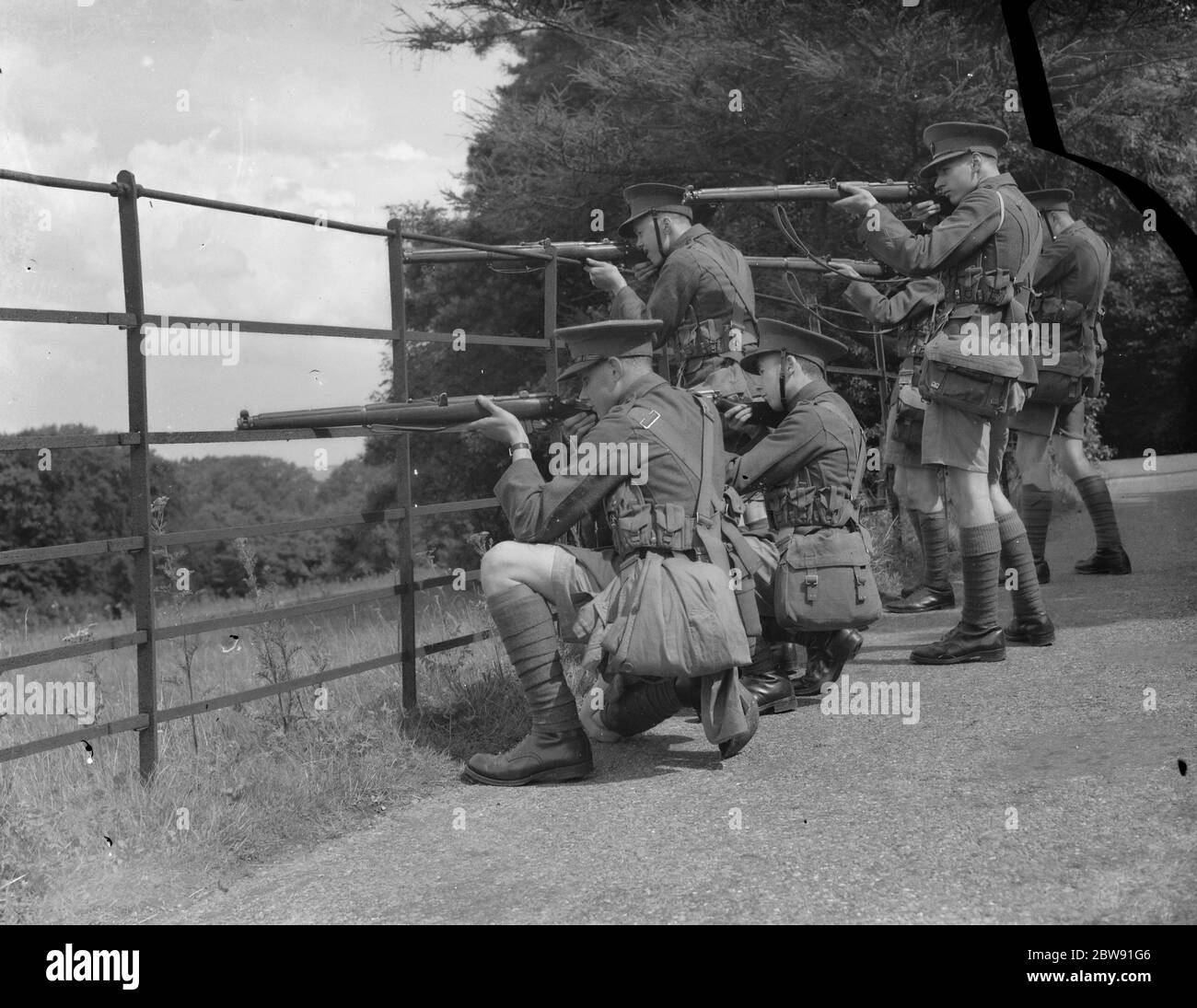 Boys from St Dunstan ' s School Cadets perform field drills armed with ...