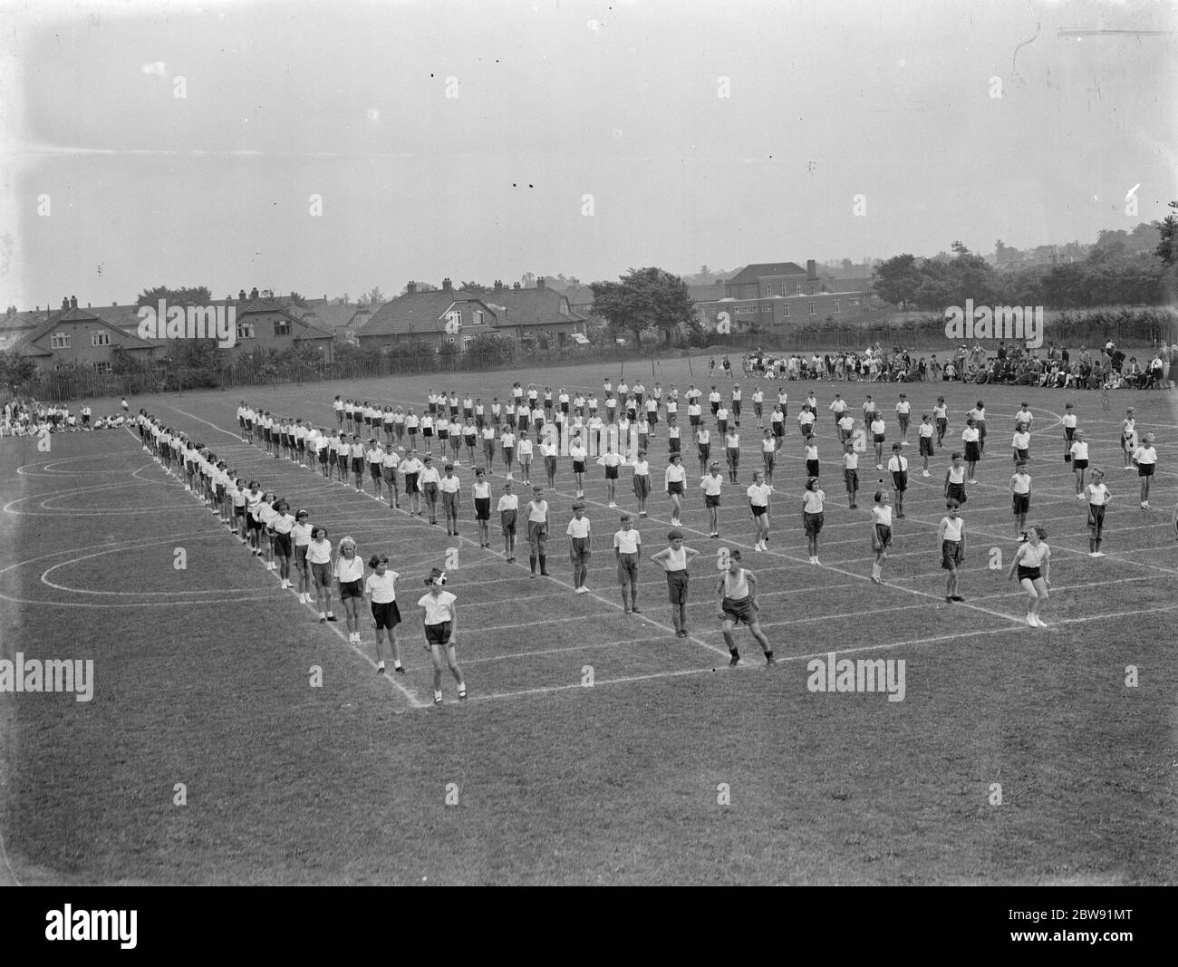 Children perform physical training drill . 1939 . Stock Photo