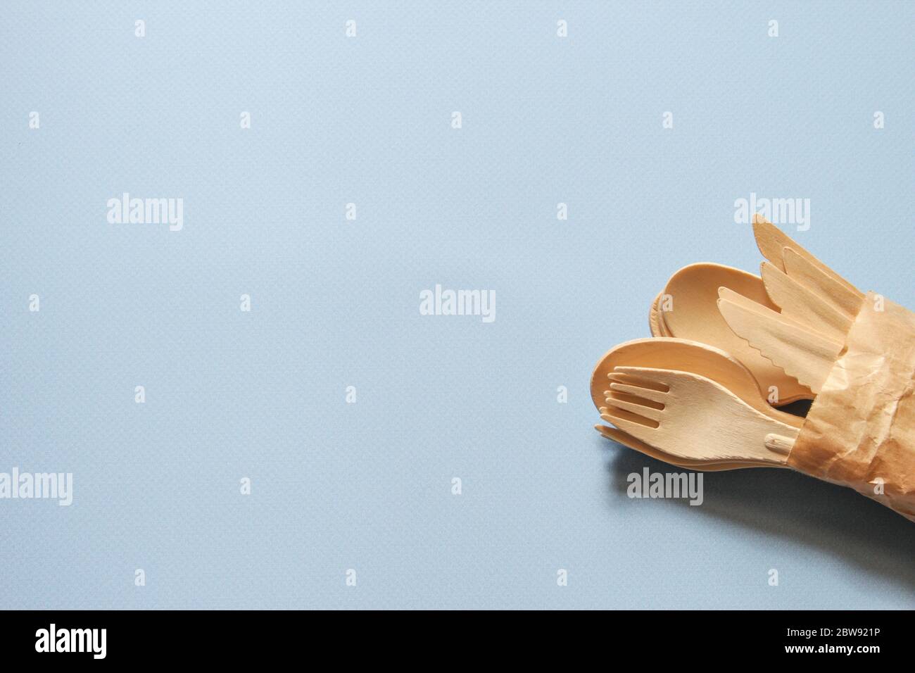 Spoons, forks, knives made of wood. Eco-friendly tableware. Stock Photo