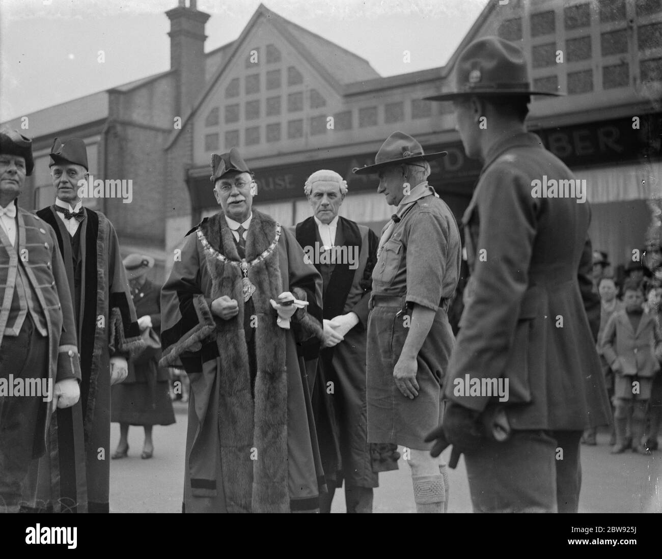 The Mayor presents a medal at the St George ' s day scout parade W A Ward ( Mayor of Dartford ) and Assistant Commander W G Philips and the town clerk . 1938 Stock Photo