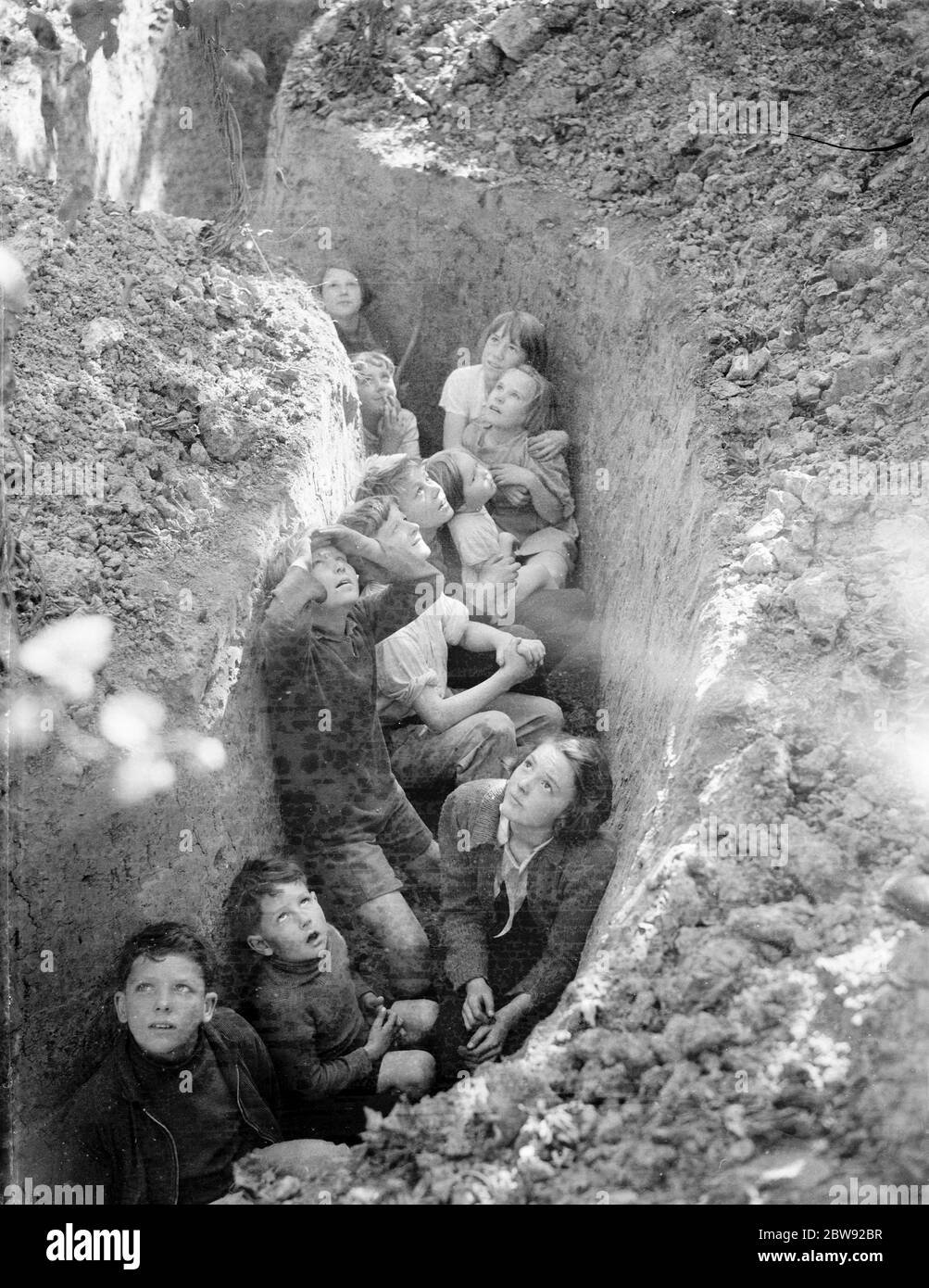 The children of hop pickers take shelter to watch the Battle of Britain . August 1940 . Stock Photo