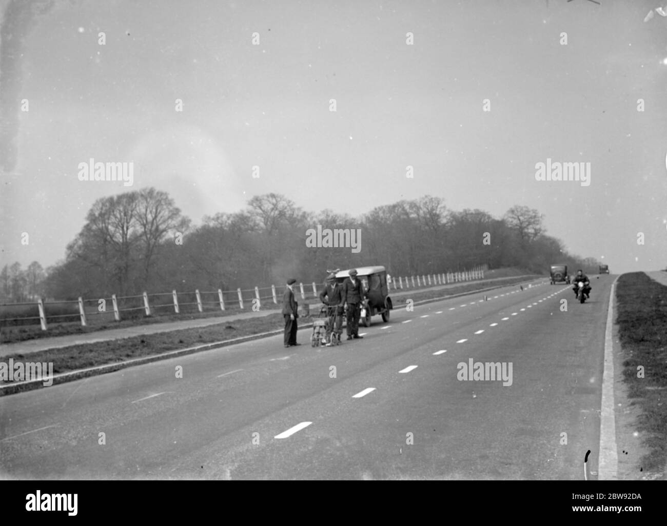 Painting white lines on the road . 1938 Stock Photo - Alamy