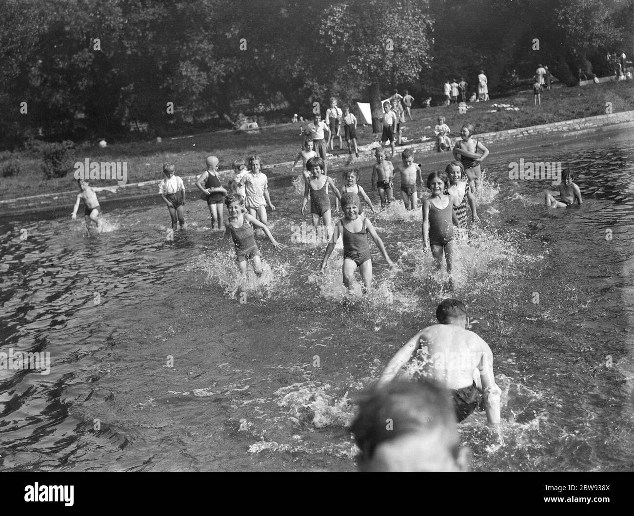 Children enjoying the paddling pool in Dartford , Kent . 1939 Stock