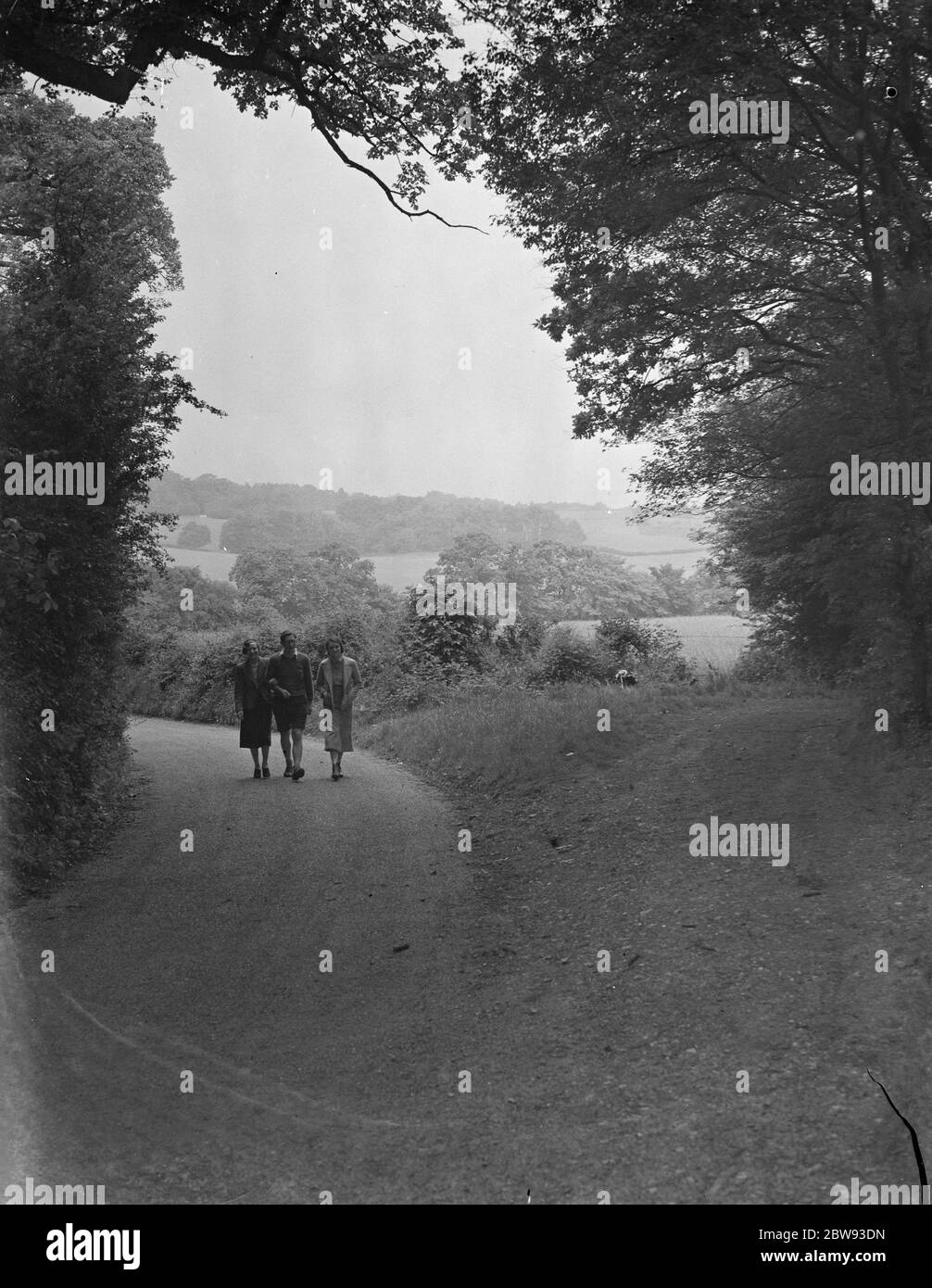 Taking a walk down Farthing Street in Farnborough , Kent , which is part of the green belt . 1939 Stock Photo