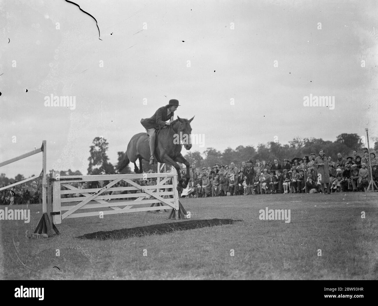 Horse jumping at the Bexleyheath Gala in Kent . A competitor make a jump . 1939 Stock Photo