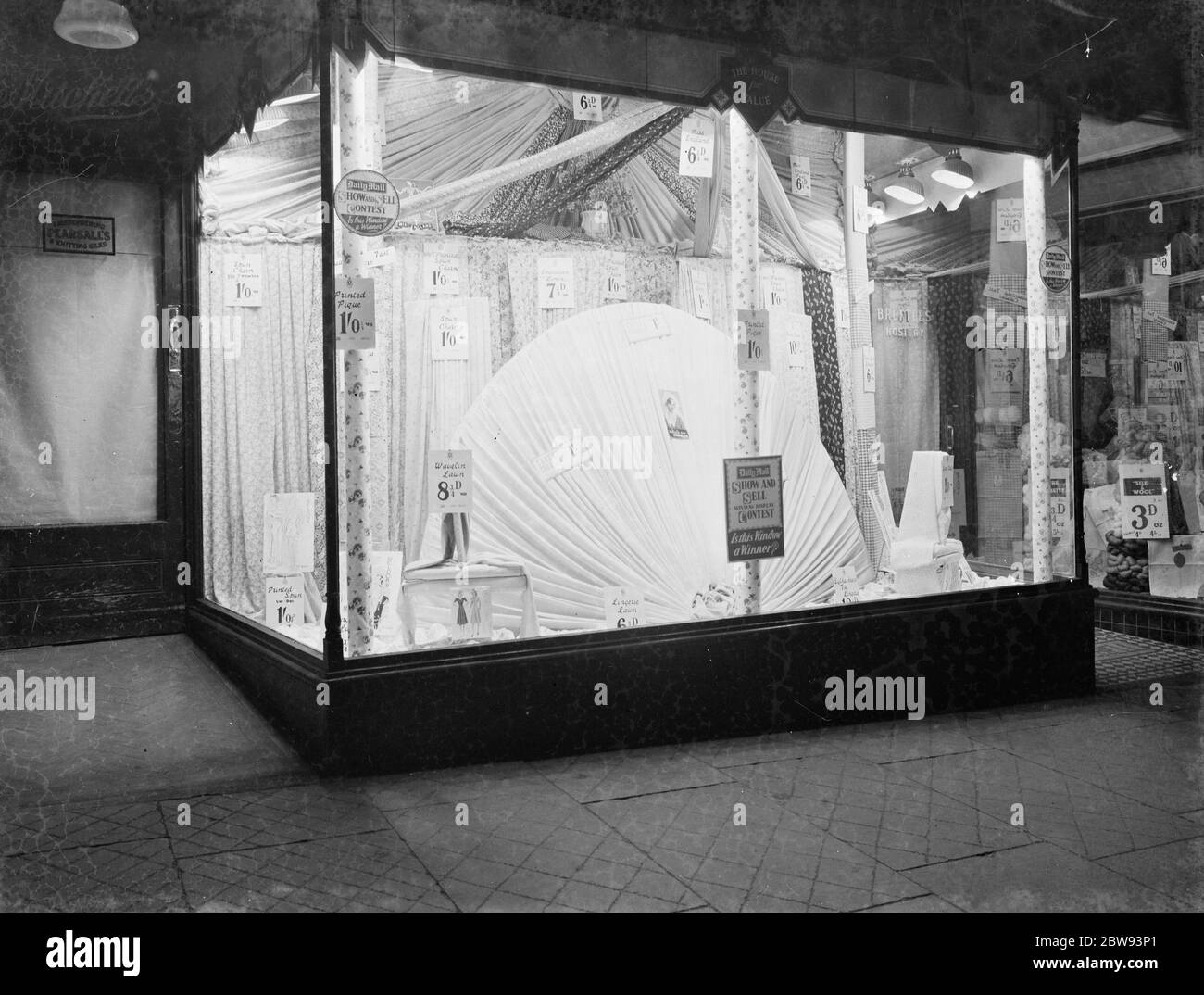The window display of a Hedley Mitchell store in Erith , London . It is taking part in a window display contest set up by the Daily Mail . 1939 Stock Photo