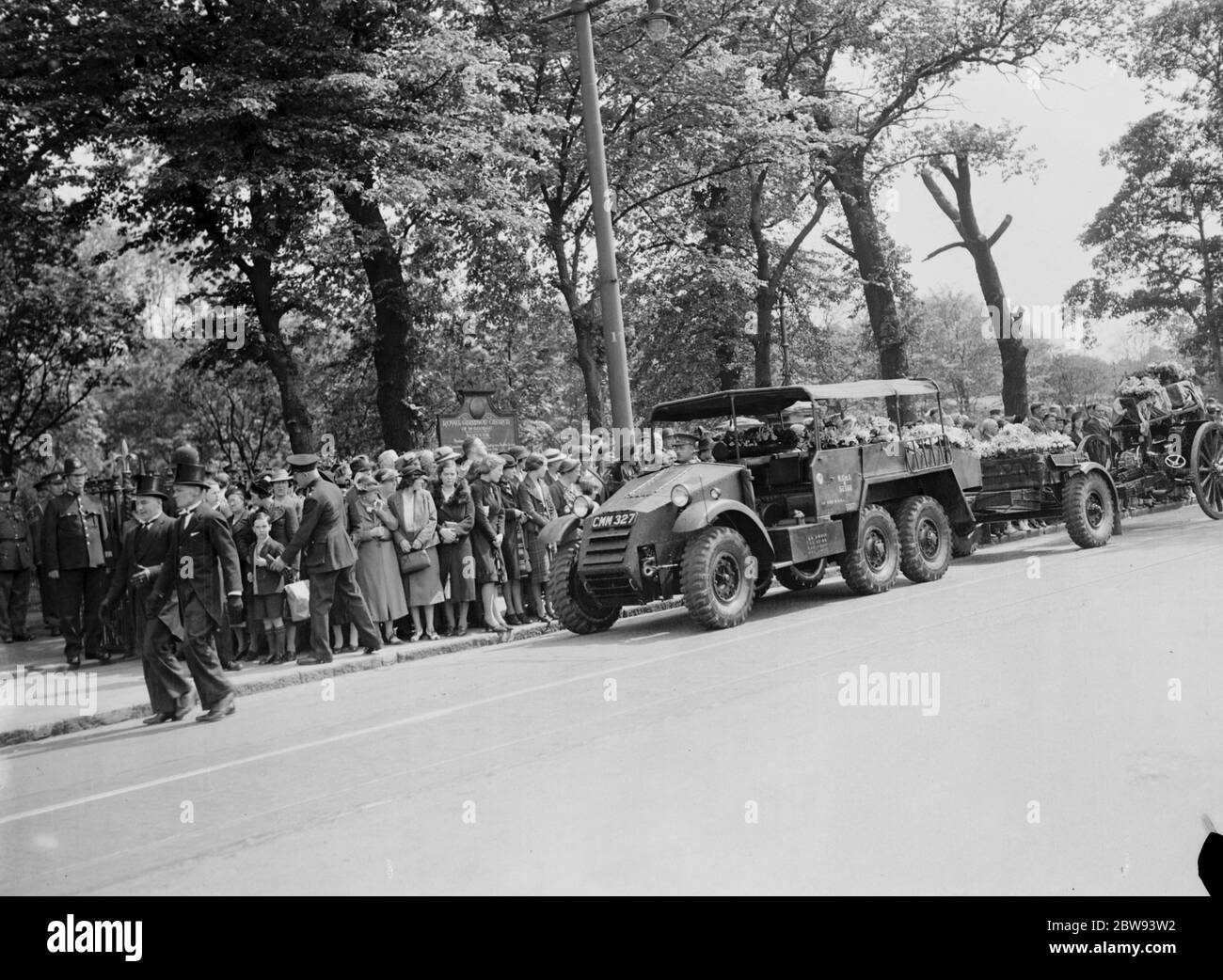A military funeral procession in Woolwich , London . An armored vehicle tows a gun carriage onto which the coffin is placed . 23 May 1939 Stock Photo