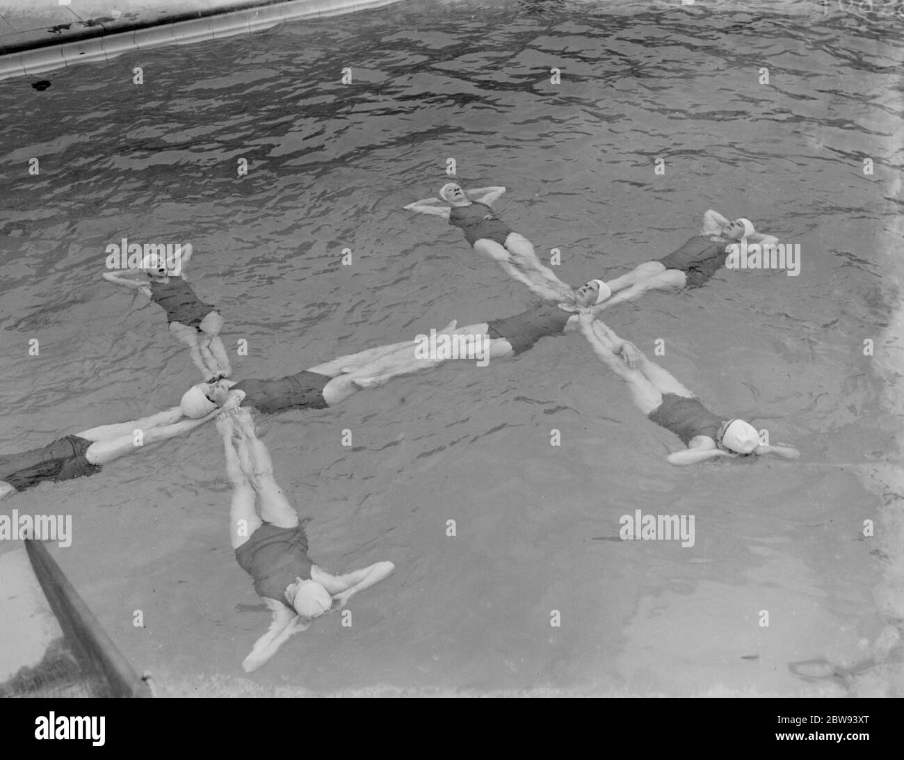 A synchronized swimming group perform a floating display at the opening