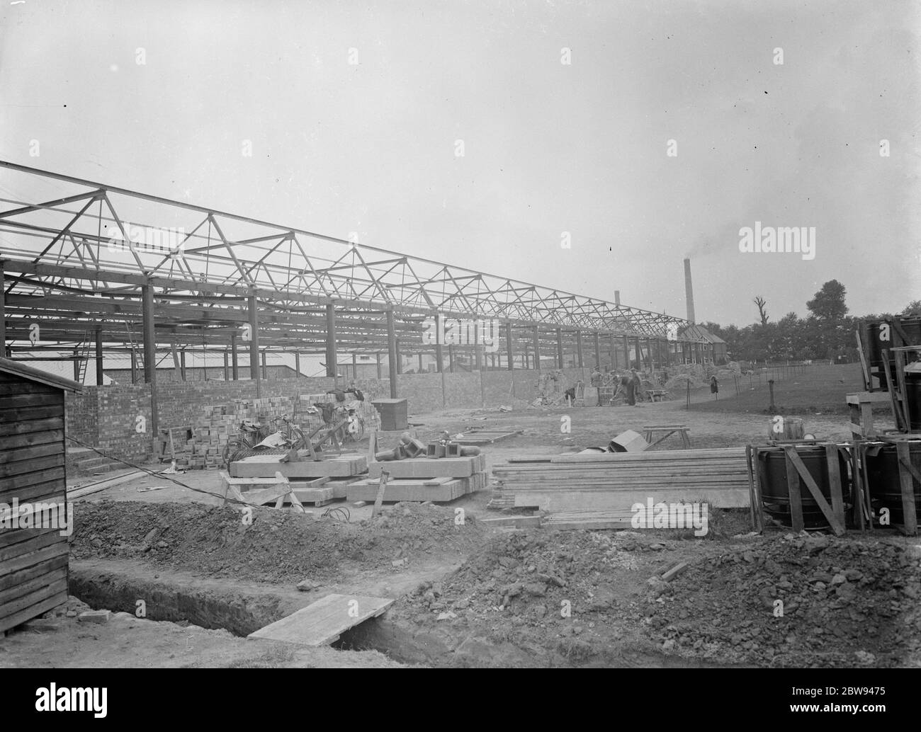 The St Helens Cable & Rubber Company Limited factory being constructed in Slough , Buckinghamshire . The steel work is being carried out by Edward Wood & Company . 1938 Stock Photo