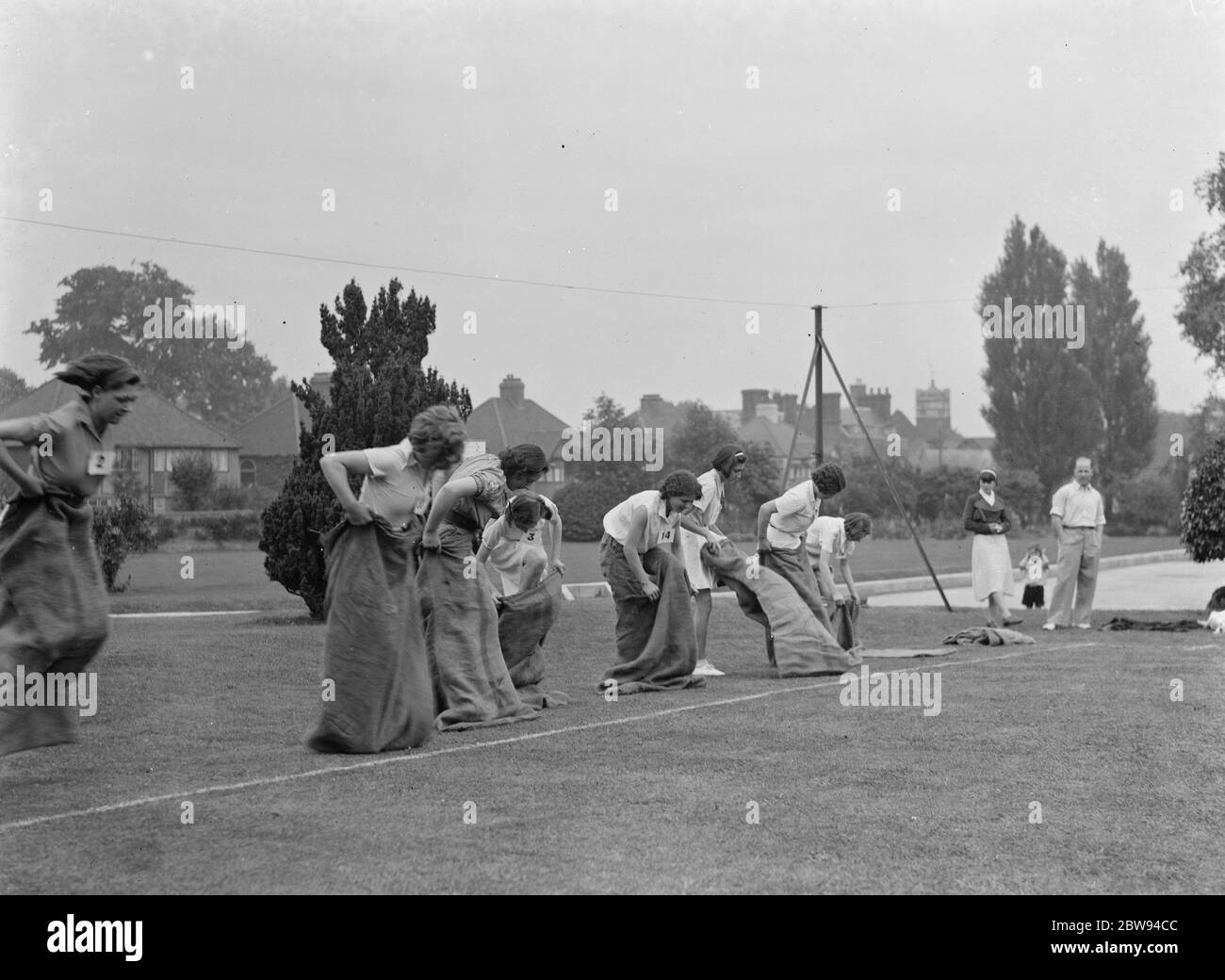 Wallingraph Sports in Eltham , Kent . Girls get ready for the sack race . 1937 . Stock Photo