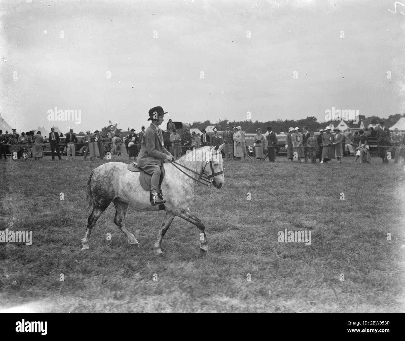 Young girl in horse riding Black and White Stock Photos & Images Alamy