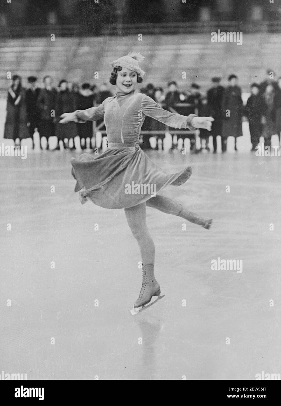 World figure skating champion prepares to defend her title at Stockholm . Sonja  Henie , the Norwegian figure skating champion of the world is practising at  Stockholm for the world skating championships .