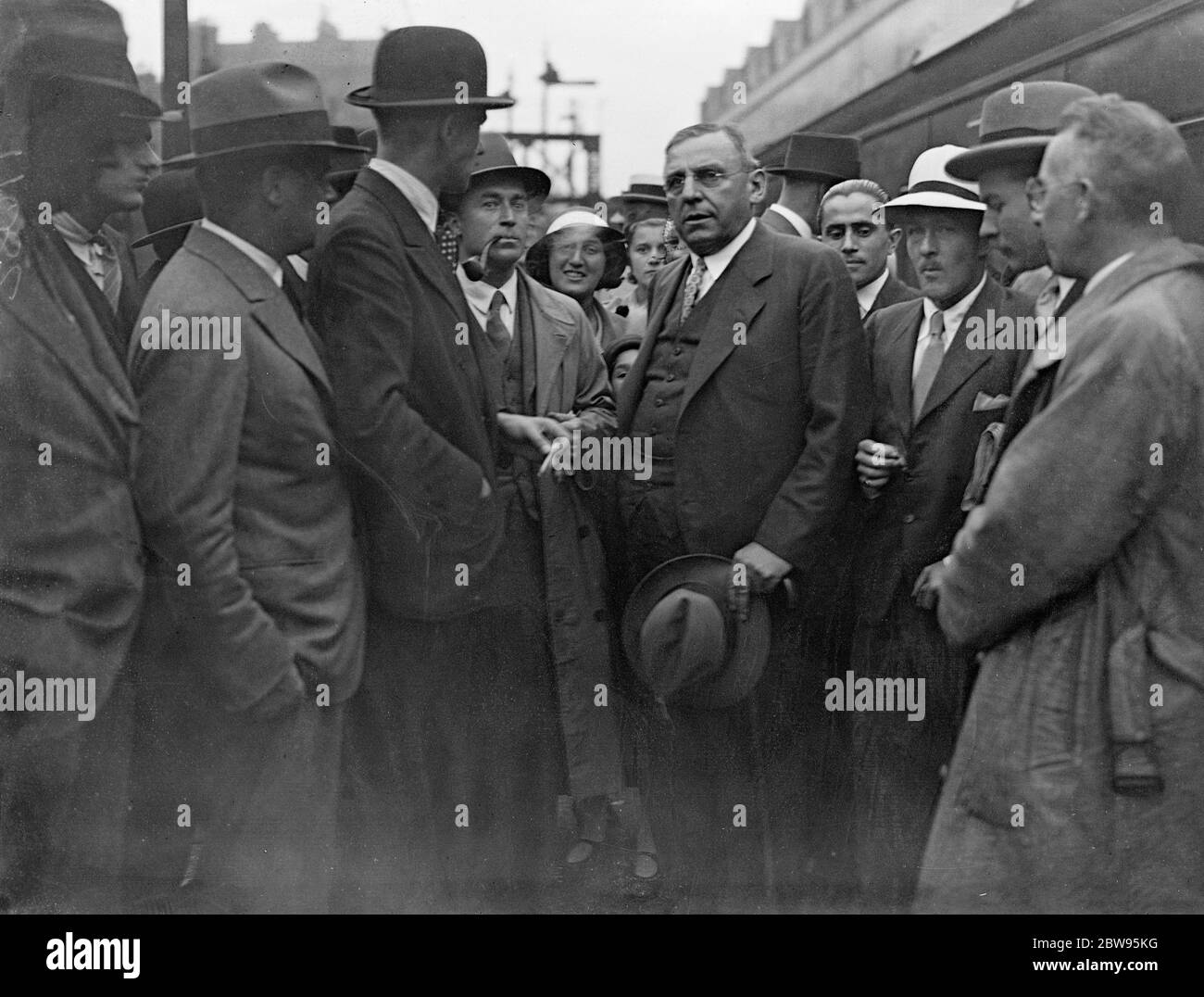 Mayor of Chicago arrives in London on way to Ireland . Mayor Anton Cermak of Chicago who is making a European tour advertising the forthcoming World War Fair in Chicago , arrived in London on his way to Dublin . He will make a prolonged visit to London later . When Mr Cermak became Mayor of Chicago in April this year , he vowed to  clean up  the city in sixty days . He declares that London 's Limehouse , the Eastern section of the city , is as bad as Chicago . Mayor Anton Cermak of Chicago at Victoria station , London , on arrival , surrounded by reporters . 1 September 1932 Stock Photo