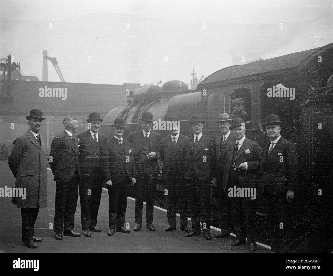 Station masters meeting in London to discuss their problems . Station masters from the London and North Eastern Railway stations all over England met at Liverpool Street station , London , for a conference to discuss their problems and establish personal contact between the stations . Among those present were station masters from Hull , Sunderland , Dundee , Manchester , Newcastle , Edinburgh , York , Glasgow , Marylebone and Kings Cross . Some of the station masters attending the conference chatting to an engine driver at Liverpool Street station , whose master Mr Hubert Calver may be seen ne Stock Photo