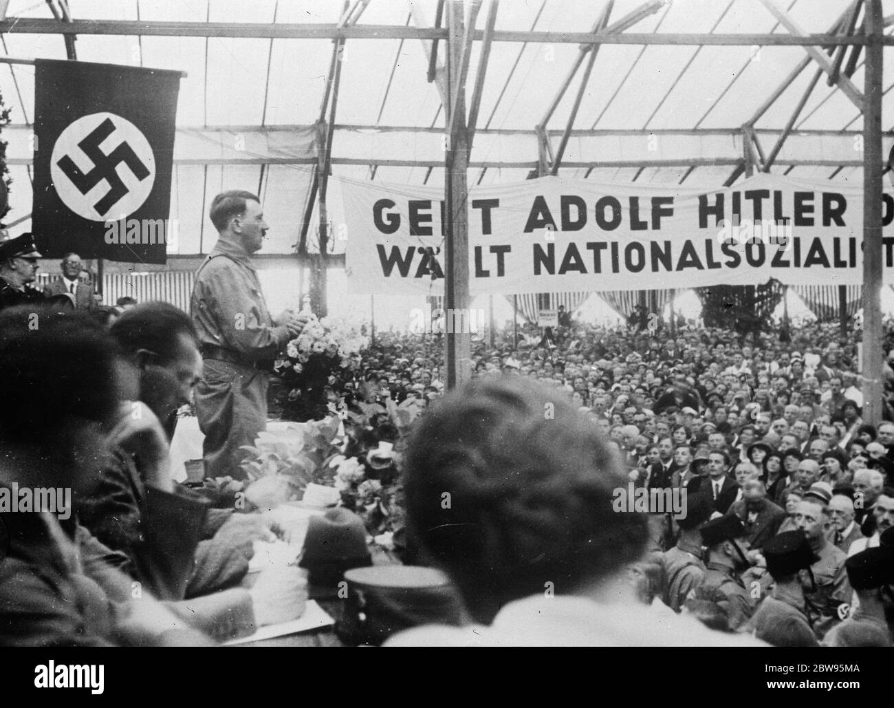 Hitler ' s final appeal in Germany . Adolf Hitler , the German Dascist leader making a final appeal for his party before the national elections . An attempt on his life was made on Saturday by the communists . Stock Photo