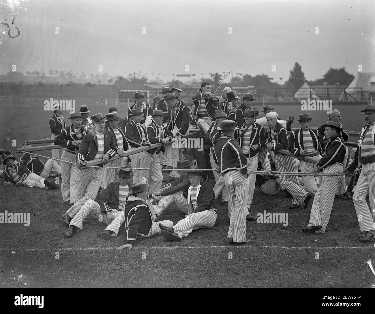 Chatham rehearses for navy week . Manning the captain . A rehearsal of the Navy week programme was carried out at Chatham . Manning the giant capstan , singing sea shanties , which will be a feature of the Chatham Navy Week . 29 July 1932 Stock Photo