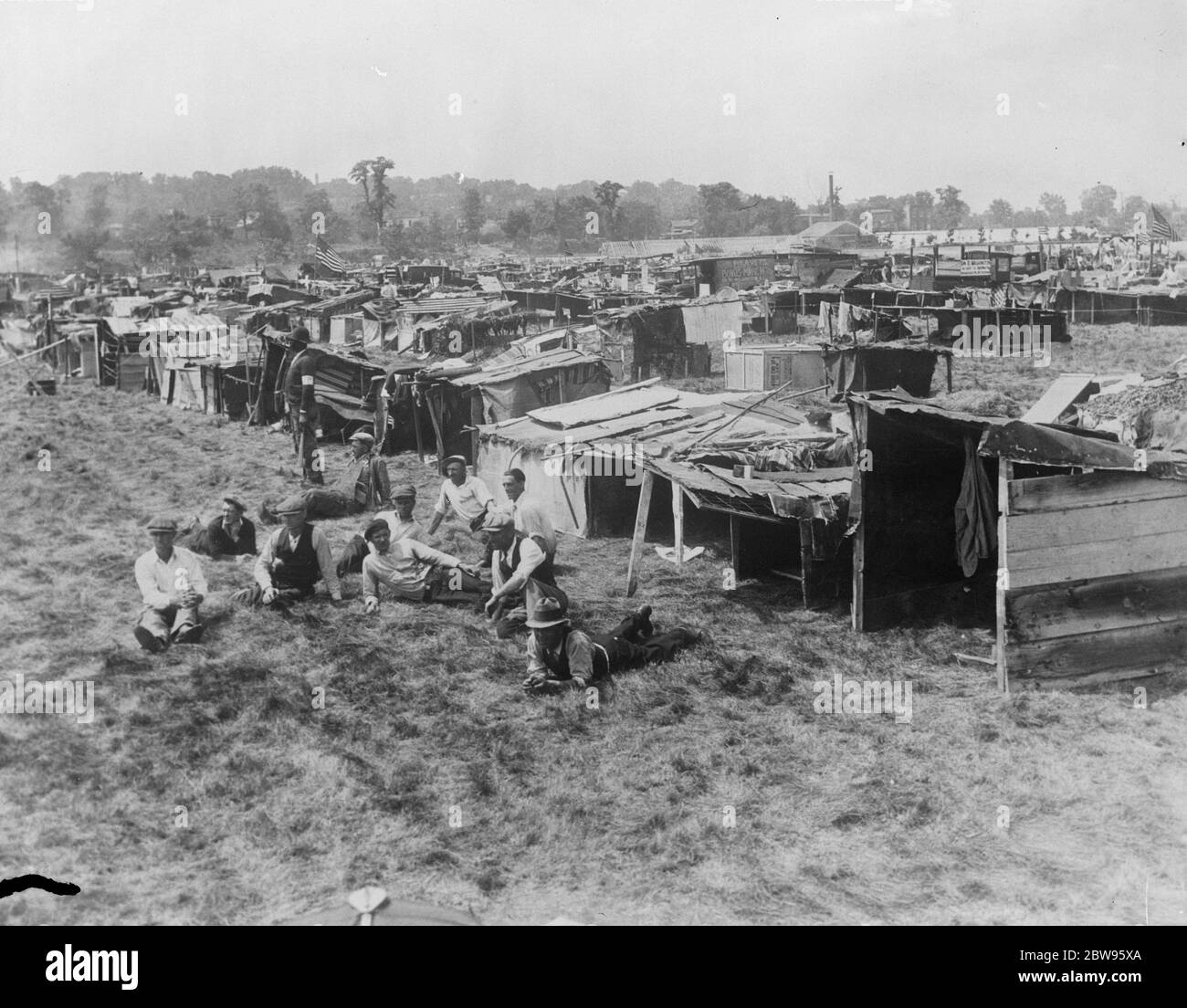 State troops rout bonus army veterans and burn camp at Washington . State toops routed several thousand Bonus Army Veterans , who have been in camp just outside Washington for the past three months , following their refusal to disperse quietly when ordered by the authorities , Their camp of shacks has been burned to the grounds . The bonus army marchers in camp at Washington from which they have been routed and their camp burned . 29 July 1932 Stock Photo