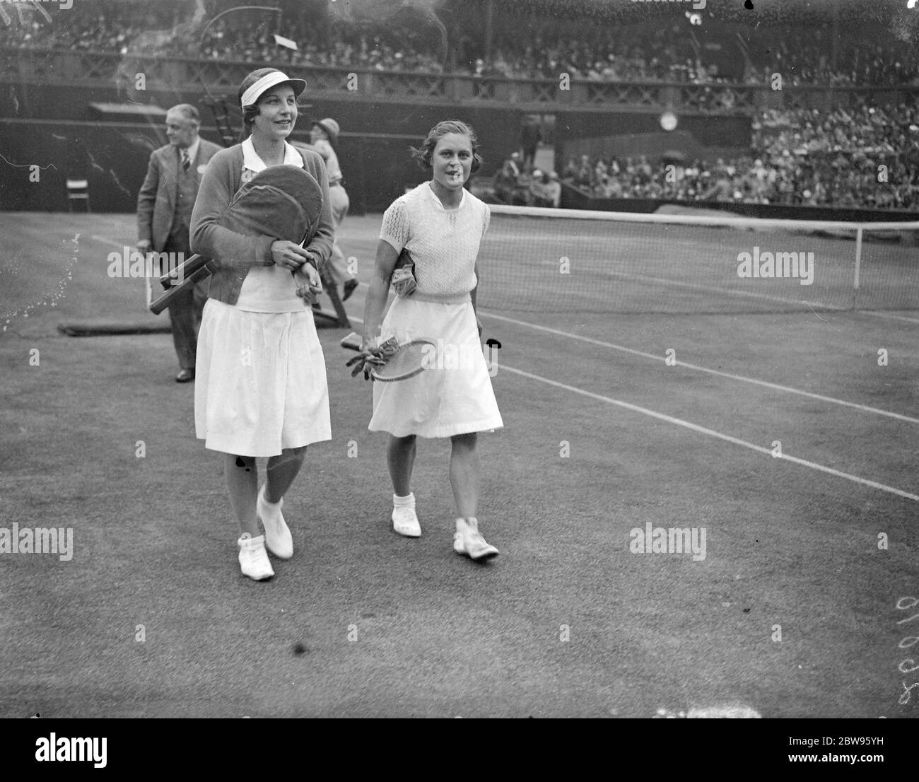 Helen Wills Moody defeats Mary Heeley in Wimbledon semi finals . Mrs Helen Wills Moody the American tennis star defeated Miss Mary Heeley the young Birmingham , England , girl in the semi finals of the womens singles in the Wimbledon tennis championships . Score was 6-2 , 6-0 . Mrs Wills Moody and Miss Mary Heeley walking off the court after the match . 30 June 1932 Stock Photo